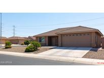 House exterior with a two-car garage and desert landscaping at 11235 E Pampa Ave, Mesa, AZ 85212