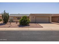 Single-story home with desert landscaping at 1729 Leisure World --, Mesa, AZ 85206
