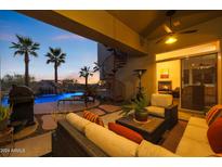 Relaxing covered patio with comfortable seating and fireplace at 8497 E Montello Rd, Scottsdale, AZ 85266