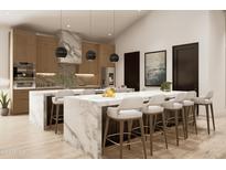 Modern kitchen with large island and marble countertops at 2136 E Paradise Ln, Phoenix, AZ 85022
