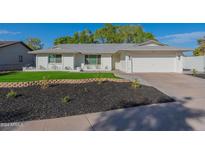 Updated single-story home with landscaped yard and attached garage at 6646 S La Rosa Dr, Tempe, AZ 85283