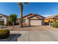 Single-story home with attached garage and desert landscaping at 8714 W Heber Rd, Tolleson, AZ 85353