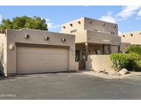 Southwest style home with attached garage and desert landscaping at 38065 N Cave Creek Rd # 4, Cave Creek, AZ 85331