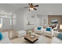 Bright and airy living room with seating area and dining space at 10910 E Oro Ave, Mesa, AZ 85212