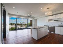 Modern kitchen with granite island and city views at 4422 N 75Th St # 4011, Scottsdale, AZ 85251