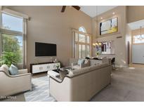 Spacious living room with high ceilings and lots of natural light at 3839 N St Elias Cir, Mesa, AZ 85215