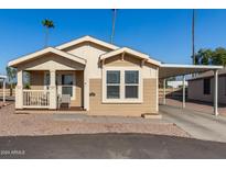 Charming single-wide manufactured home with covered porch at 649 N 67Th Dr # 25, Phoenix, AZ 85043