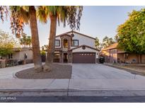 Two story house with a large driveway and landscaping at 944 S Grand --, Mesa, AZ 85210