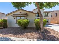 Two-story home with Spanish style architecture and landscaping at 18337 W Stinson Dr, Surprise, AZ 85374
