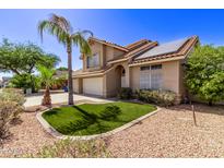 Two-story house with solar panels, three-car garage, and landscaped front yard at 2726 N Ricardo --, Mesa, AZ 85215