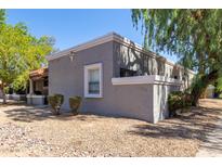 Exterior view of a condo with desert landscaping at 4820 N 89Th Ave # 100, Phoenix, AZ 85037