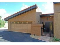 Tan colored garage with attached entry to home at 7435 E Sundance Trl # 403, Carefree, AZ 85377