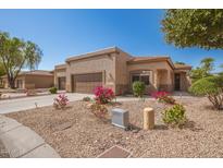 Well-maintained stucco home with a two-car garage and desert landscaping at 26 S Quinn Cir # 7, Mesa, AZ 85206