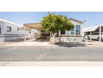 Mobile home exterior with carport and landscaping at 7750 E Broadway Rd # 277, Mesa, AZ 85208