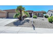 One-story house with desert landscaping at 17041 W Artesia Dr, Surprise, AZ 85387