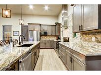 Gourmet kitchen with granite countertops and stainless steel appliances at 26401 N Trails End --, Rio Verde, AZ 85263