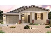 One story home with a two car garage and desert landscaping at 24573 W Hopi St, Buckeye, AZ 85326