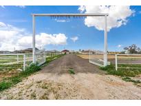 Stardust Ranch entrance with open gates at 14700 S Tuthill Rd, Buckeye, AZ 85326