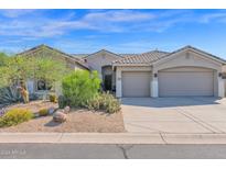 Single-story home with two-car garage and desert landscaping at 5221 E Thunder Hawk Rd, Cave Creek, AZ 85331