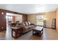 Cozy living room with adjacent dining area at 15419 N 2Nd Pl, Phoenix, AZ 85022