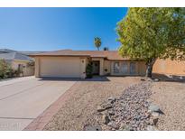 Single story home with a two-car garage and a well-manicured front yard at 16410 S 46Th Pl, Phoenix, AZ 85048