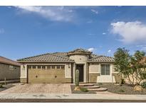 Beautiful one-story home with a two-car garage and landscaped yard at 18926 N 259Th Ave, Buckeye, AZ 85396