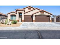 Single-story house with two-car garage and desert landscaping at 786 W Jahns Dr, Casa Grande, AZ 85122