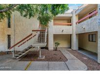 Exterior view of building with stairs and landscaping at 3119 W Cochise Dr # 245, Phoenix, AZ 85051