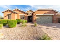 Beautiful one-story home with a welcoming front porch and landscaping at 2247 E Indian Wells Dr, Gilbert, AZ 85298