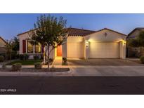 Beautiful one-story home with a two-car garage and landscaped front yard at 10331 E Wavelength Ave, Mesa, AZ 85212