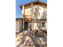 Two-story home with balcony and desert landscaping at 1765 S Fairway Cir, Casa Grande, AZ 85194