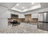 Kitchen with granite countertops and stainless steel appliances at 18202 Cave Creek Rd # 111, Phoenix, AZ 85032