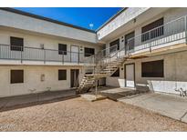 Exterior view of a building with stairs and gravel courtyard at 18202 Cave Creek Rd # 251, Phoenix, AZ 85032