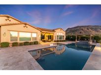 Luxury pool and spa with mountain views at sunset at 10764 N 138Th Way, Scottsdale, AZ 85259