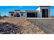 Modern home with clean lines and a two-car garage at 31214 N 167Th Ave, Surprise, AZ 85387