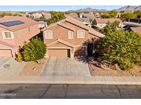 Two-story house with a large garage and landscaping, aerial view at 1542 E Chaparral Pl, Casa Grande, AZ 85122
