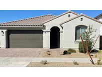 Modern stucco home with a two-car garage and desert landscaping at 14436 W Faye Way, Surprise, AZ 85387