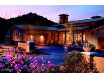 Luxury home exterior at dusk, showcasing architectural details and landscaping at 27440 N Alma School Pkwy # 136, Scottsdale, AZ 85262