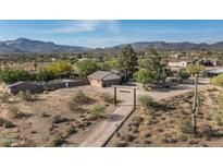 Aerial view of a ranch style home with pool and mountain views at 39839 N Spur Cross Rd, Cave Creek, AZ 85331