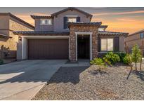 Two-story home with stone accents and a two-car garage at 23095 E Mewes Rd, Queen Creek, AZ 85142
