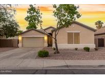 Single-story house with a two-car garage and landscaped front yard at 1384 E Morelos St, Chandler, AZ 85225