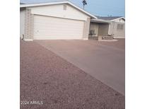 Attached garage with driveway at 908 S Ocotillo Dr, Apache Junction, AZ 85120