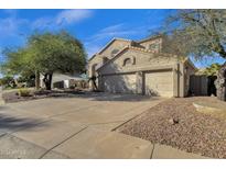Two-story home with attached two-car garage and landscaped yard at 5542 E Anderson Dr, Scottsdale, AZ 85254