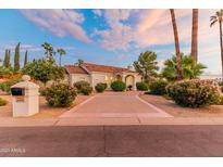 Beautiful home exterior with manicured landscaping at 8575 E Sharon Dr, Scottsdale, AZ 85260