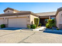 Tan two-car garage with front entry and landscaping at 846 N Pueblo Dr # 110, Casa Grande, AZ 85122