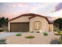 One-story home with a two-car garage and desert landscaping at 1428 W Hopi Dr, Coolidge, AZ 85128