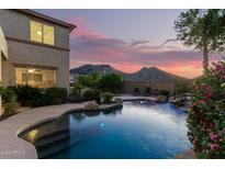 Stunning pool and spa with mountain views at sunset at 5616 W Molly Ln, Phoenix, AZ 85083