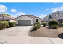 Single story house with attached garage and landscaping at 38169 N Rusty Ln, San Tan Valley, AZ 85140