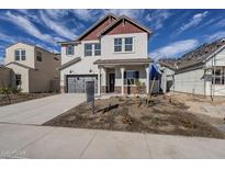 Two-story home with gray siding, red accents, and a landscaped front yard at 17978 W Long Lake Rd, Goodyear, AZ 85338