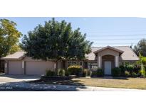 Single story home with a two-car garage at 2057 E Marquette Dr, Gilbert, AZ 85234